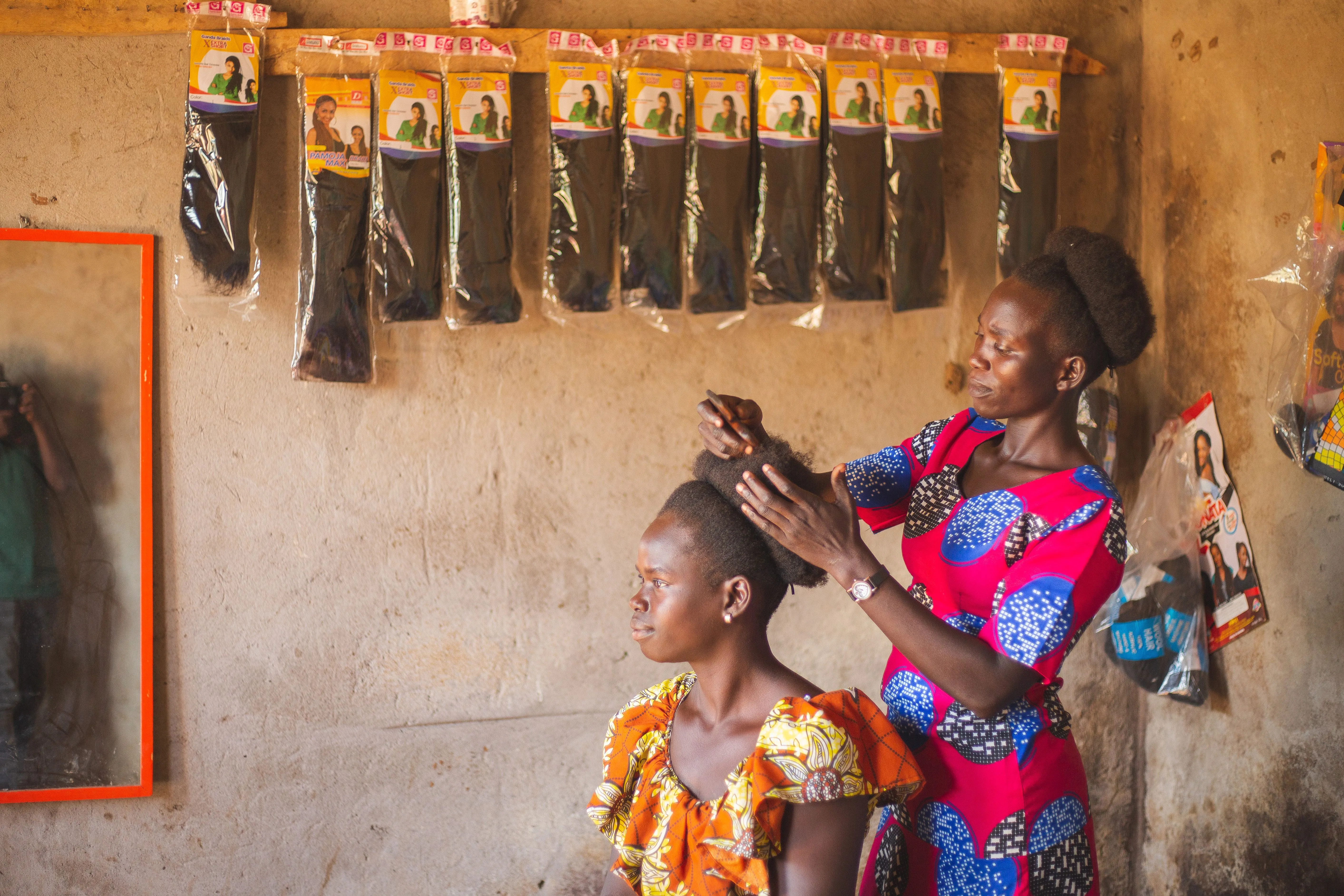 Kenyan community health worker providing care