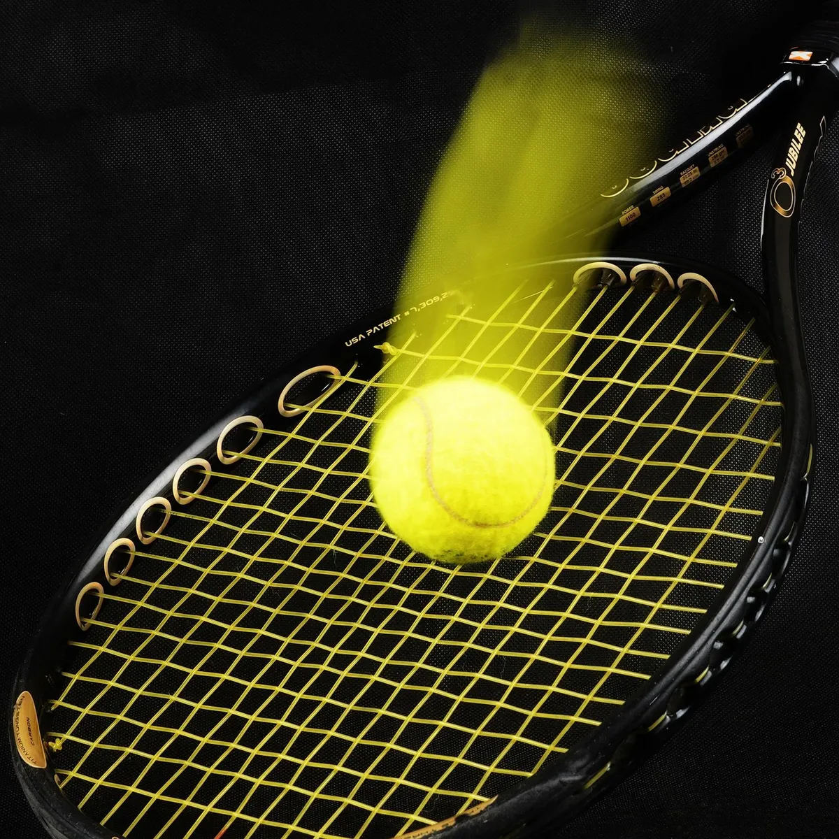 Tennis racket connecting with a ball