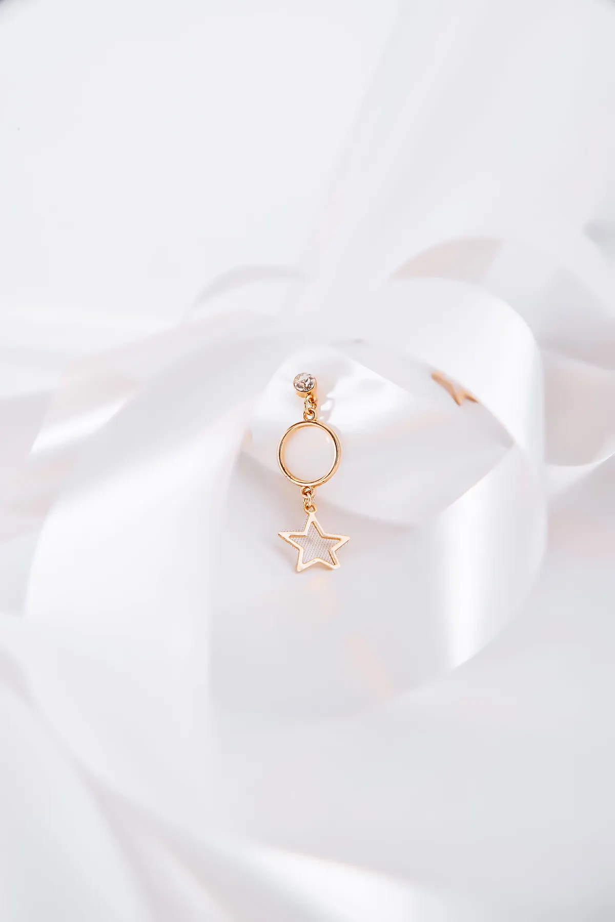 Handcrafted gold earring detail