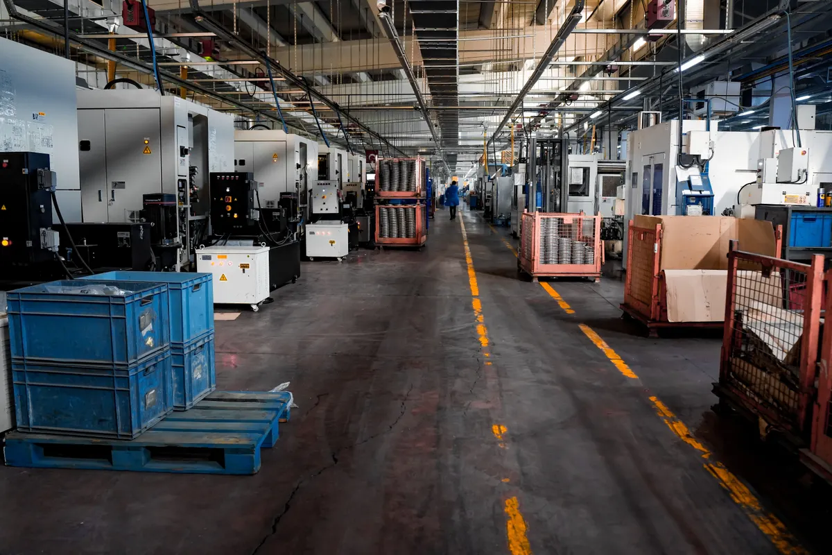 Industrial factory floor representing global manufacturing reach