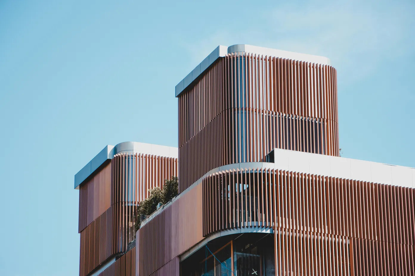 Marketwave Limited modern brown concrete corporate building exterior during daytime