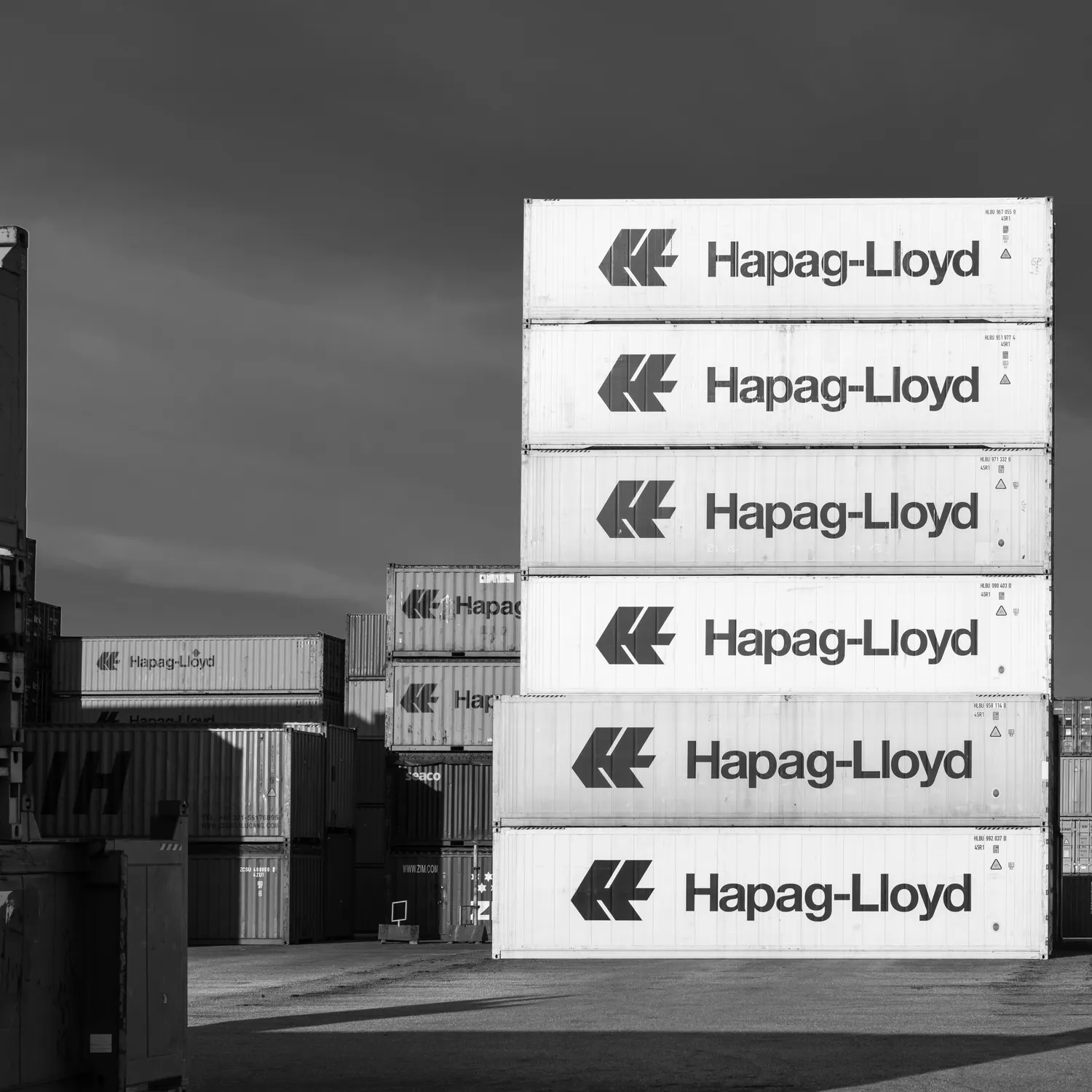 Industrial port shipping containers representing global trade lines