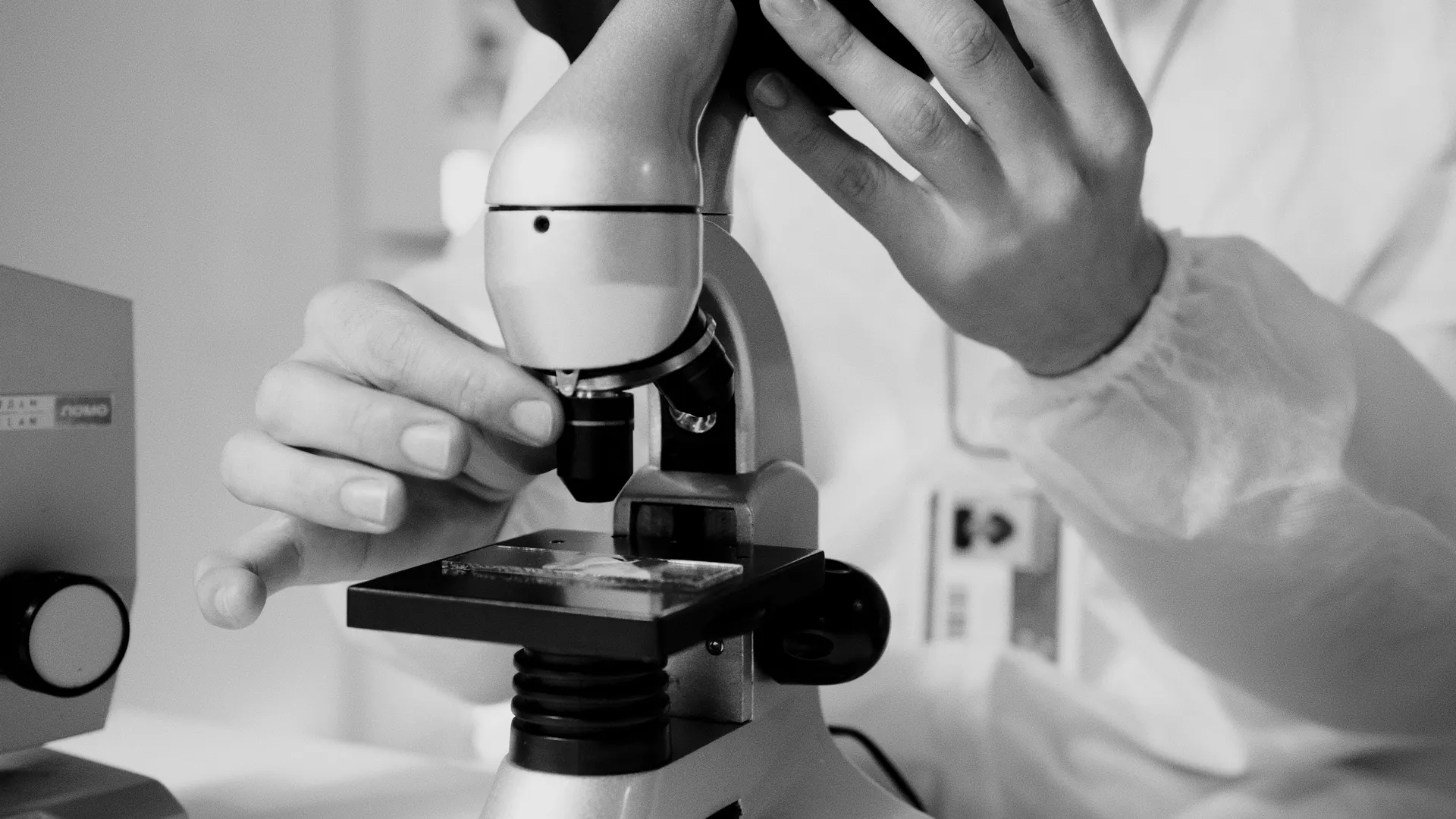 Scientist using a microscope in a laboratory