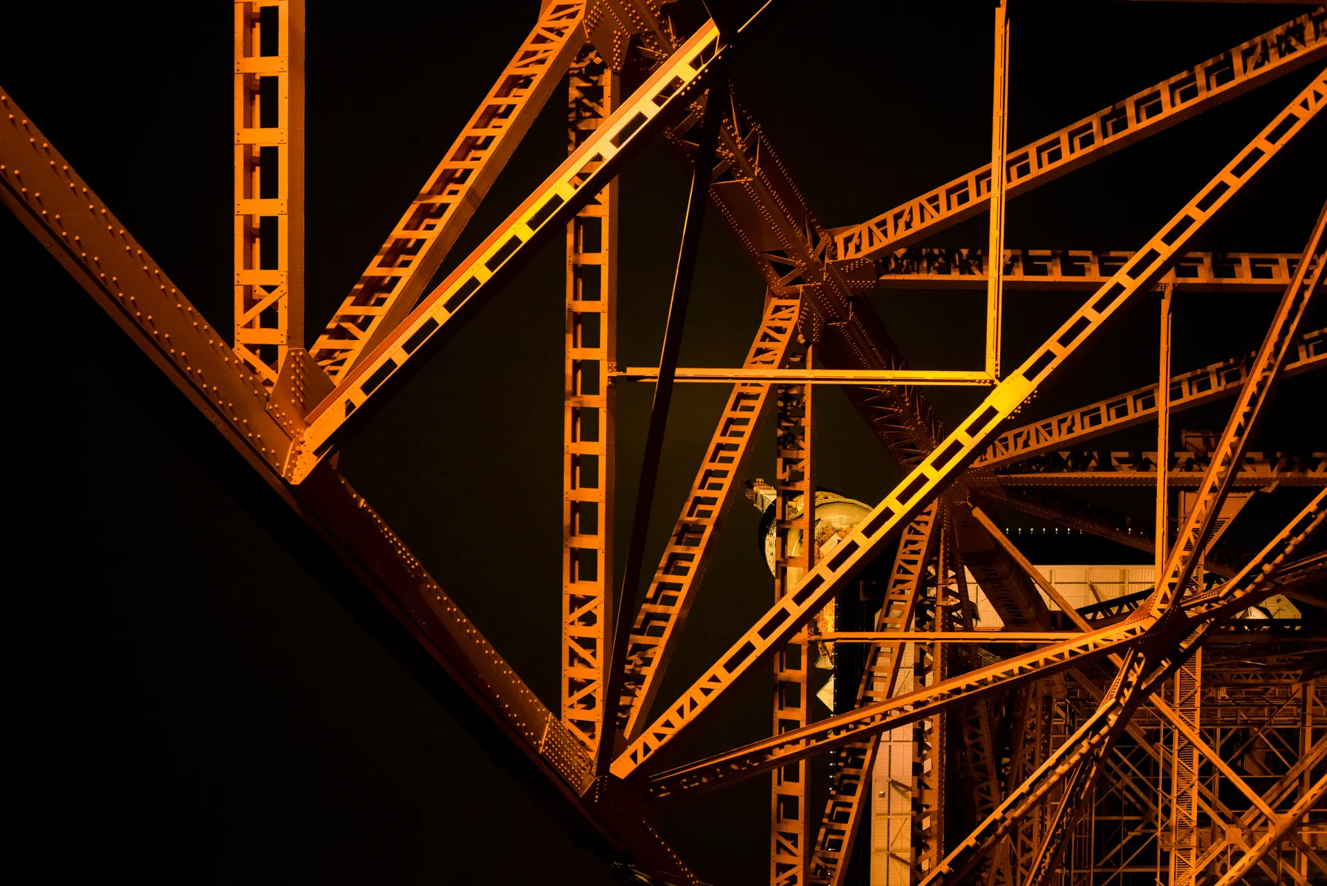 Industrial steel superstructure illuminated at night
