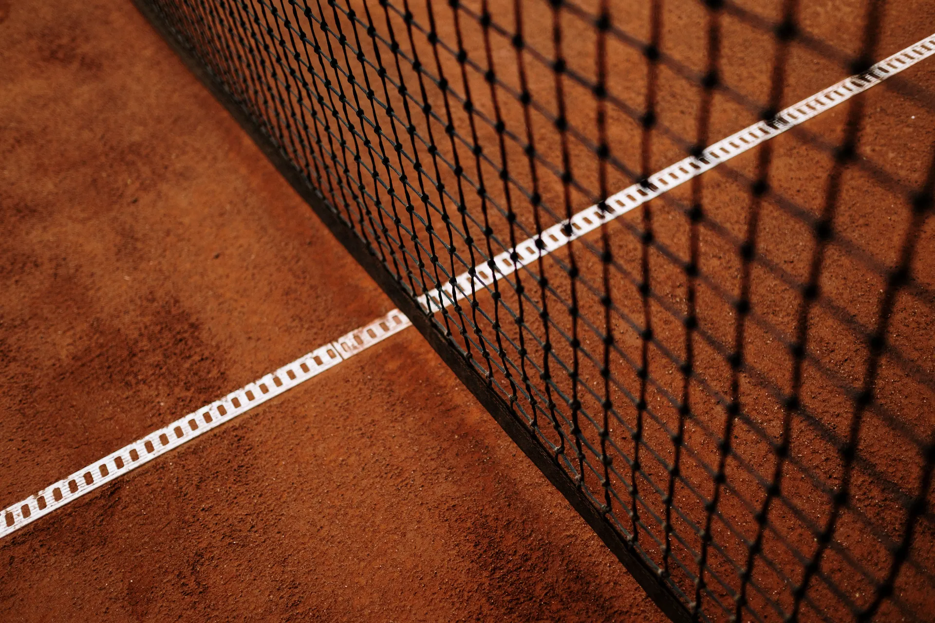 High angle shot of a pristine tennis court baseline