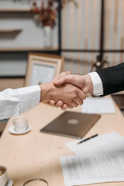 Business partnership handshake