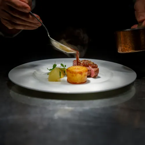 Chef plating a dish
