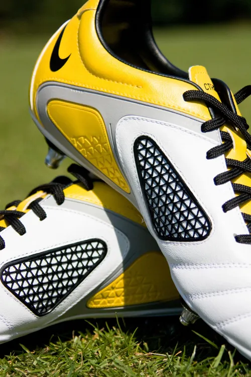 Close up of soccer boots on grass