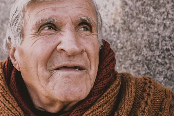 Happy senior man laughing during an outdoor session