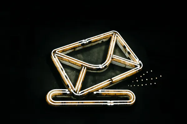 Glowing neon envelope symbol