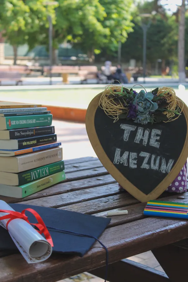 Graduation materials on wooden table
