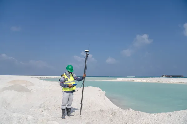 Surveyor conducting site analysis