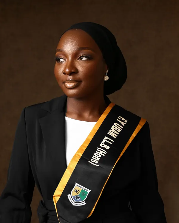 Elegant portrait of a graduating student in academic gown