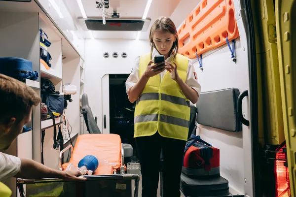 Professional paramedic preparing for a visit
