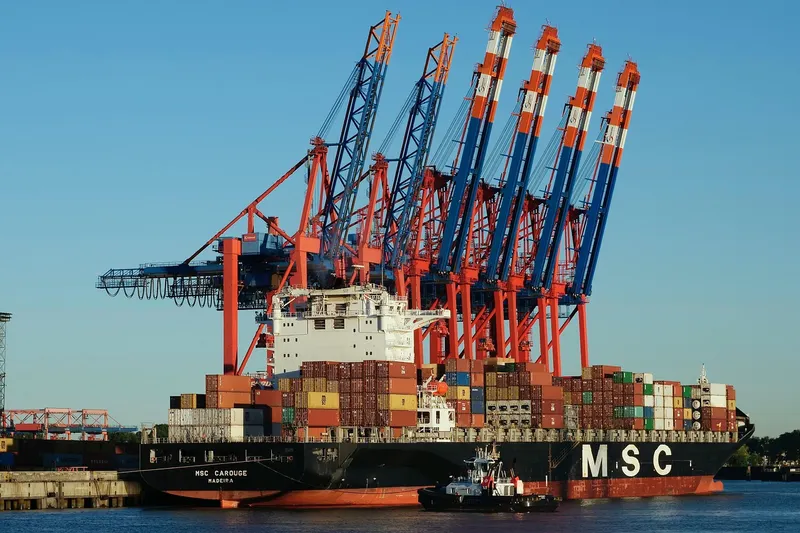 Aerial view of a Mozambique port terminal showing shipping containers and cranes