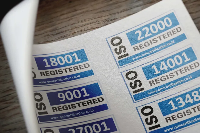 Close-up of safety file documentation and ISO certification stickers