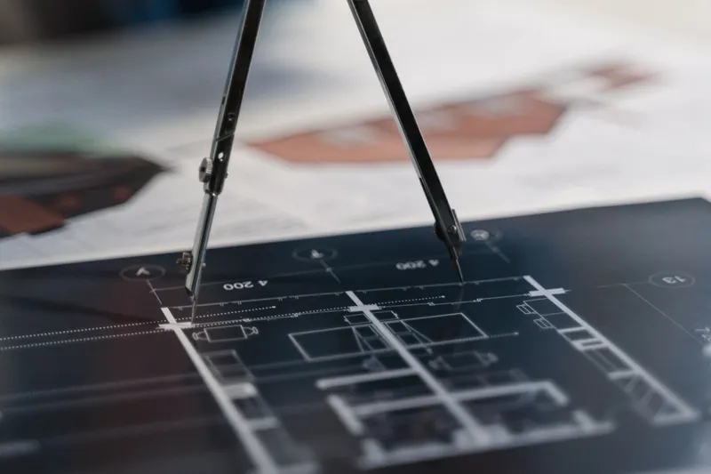 Architectural blueprints and compass