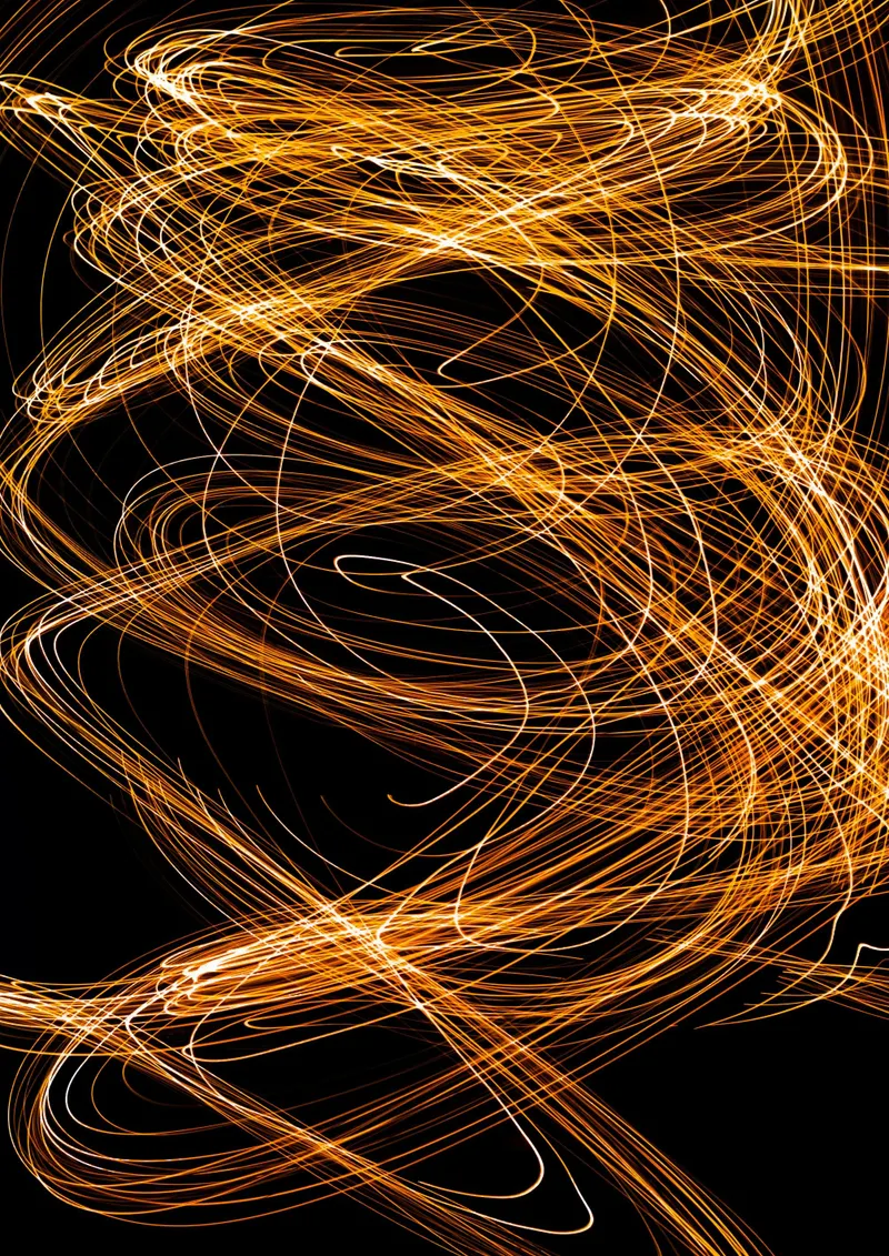 Abstract gold light trails representing fan energy
