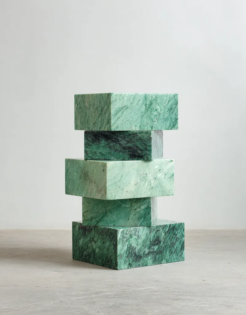 African artisan working on green marble sculpture