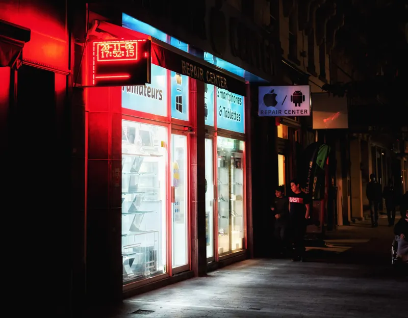 Modern Kenyan storefront with vibrant digital signage
