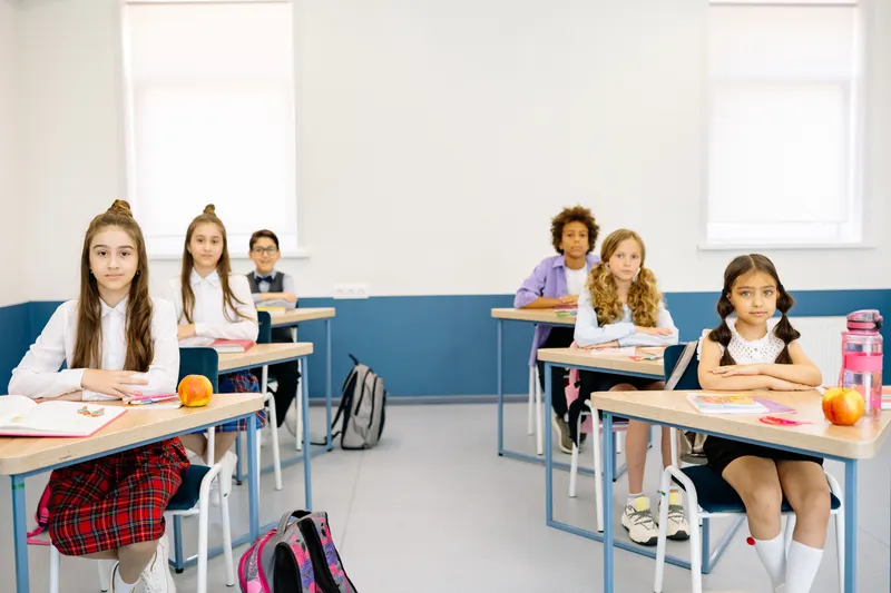 Children attentively studying in a bright classroom