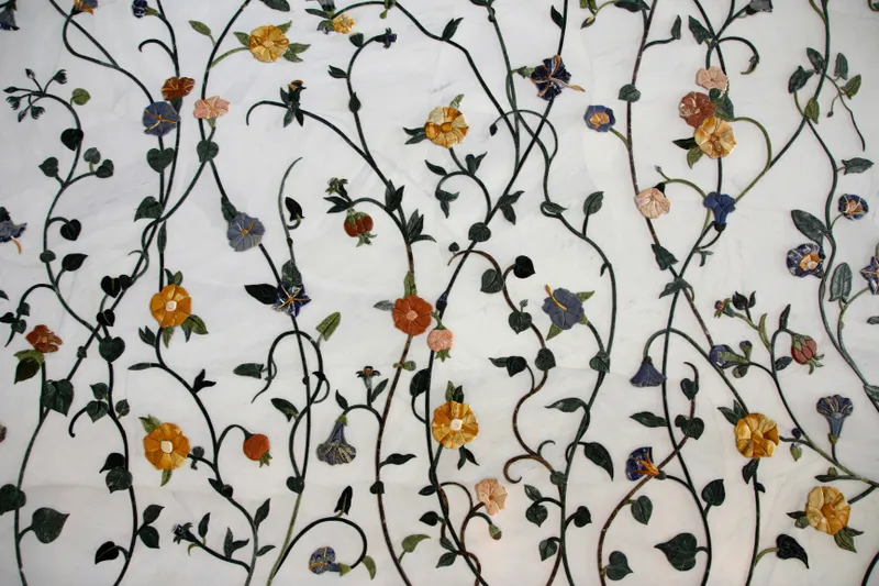Artisanal floral arrangements on marble surface
