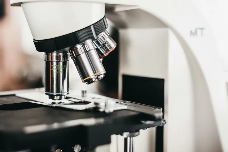Scientific microscope lens reflecting data patterns