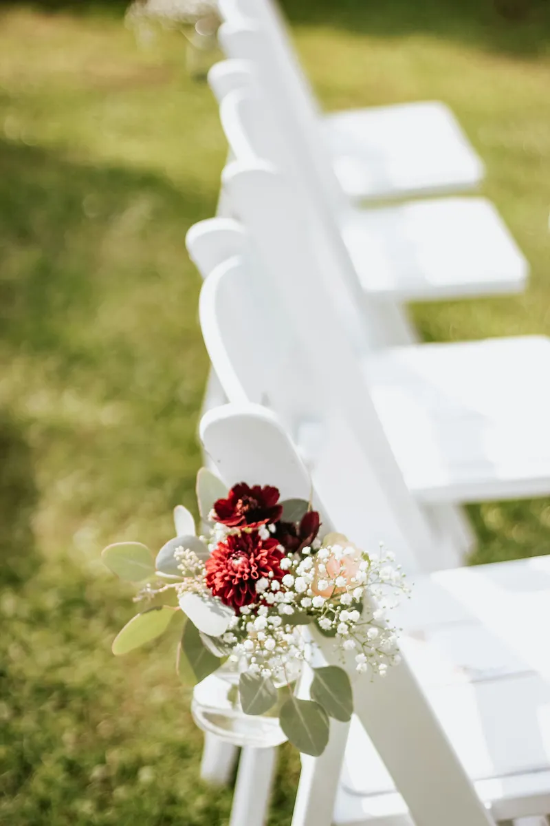 White chairs on green field